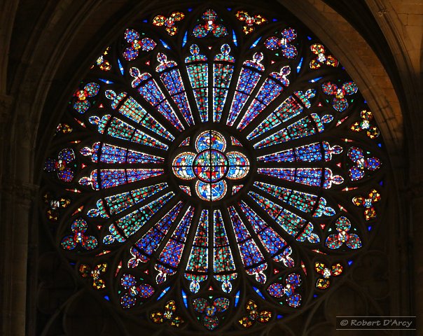 The rose window at the northern end of the transept in La basilique Saint-Nazaire which features the Crowning of the Virgin Mary surrounded by angels, prophets and saints