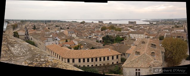 View from the top of Tour de Constance, looking over the rooftops of Aigues-Mortes with Étang de la Ville in the distance
