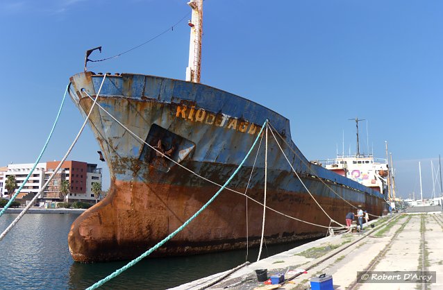 View from Quai Paul Riquet of a semi derelict transport ship in Canal Maritime